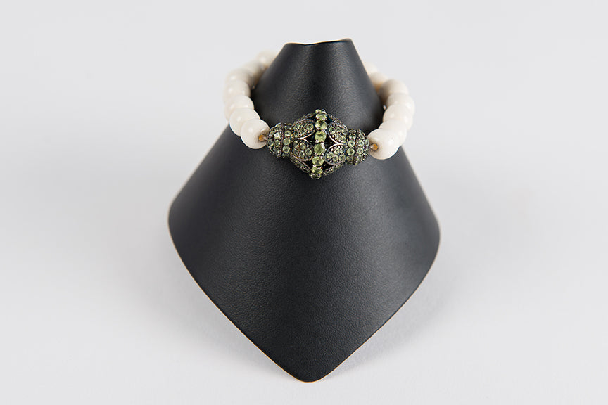 Bone with peridot focal bead