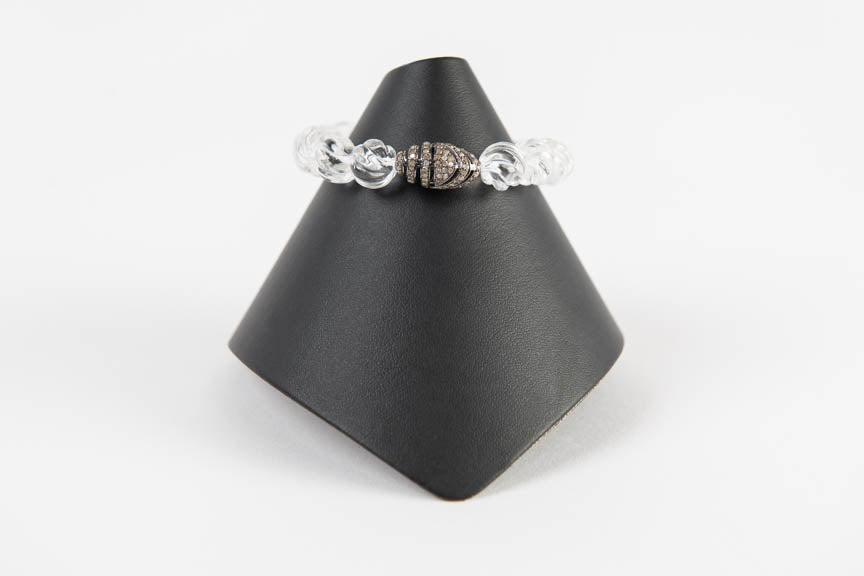 Faceted rock crystal with pave diamond bead
