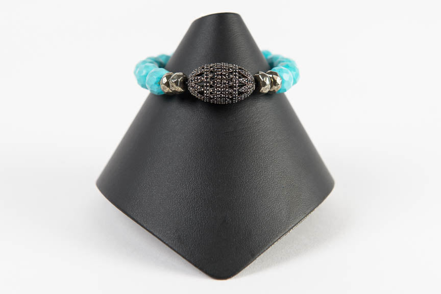 Faceted turquoise with pyrite and black spinel bead