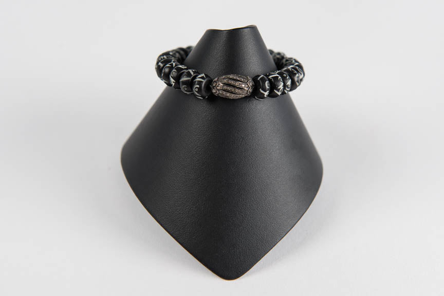 Carved bone and pave diamond bead