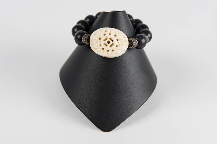 Wood and carved bone with pave diamond rondelles