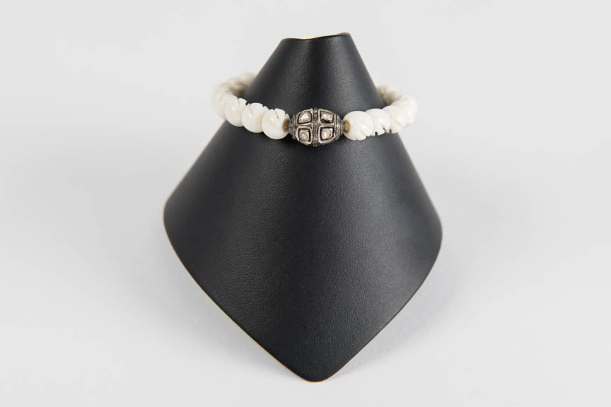 Carved bone with rose cut diamond bead