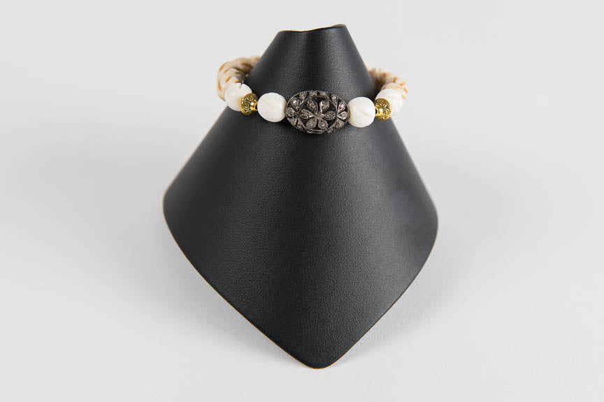 Carved bone and wood with pave diamond bead