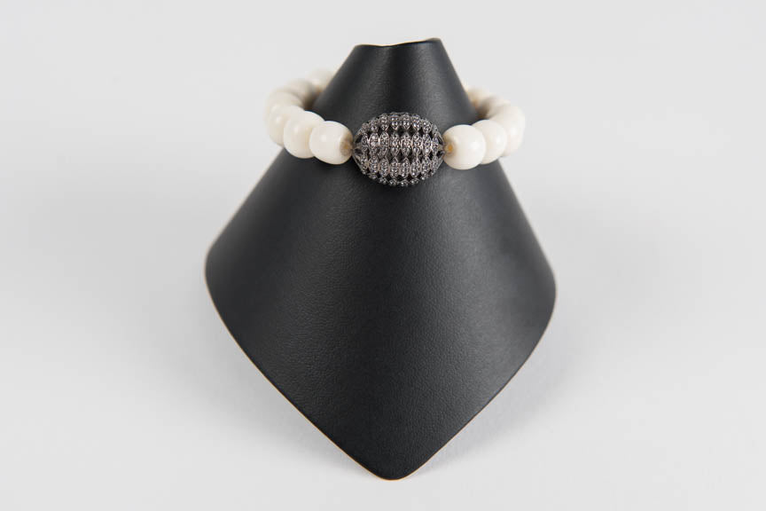 Bone with white topaz bead