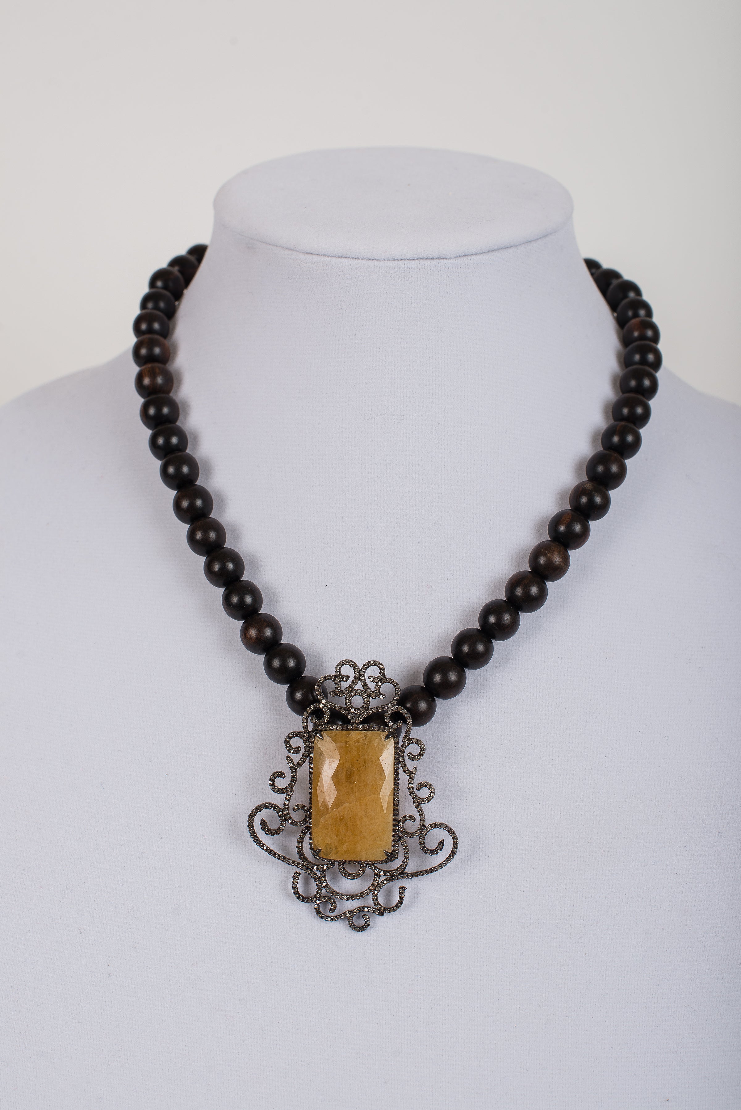 Pave Diamond and Sapphire Pendant on Ebony Wood