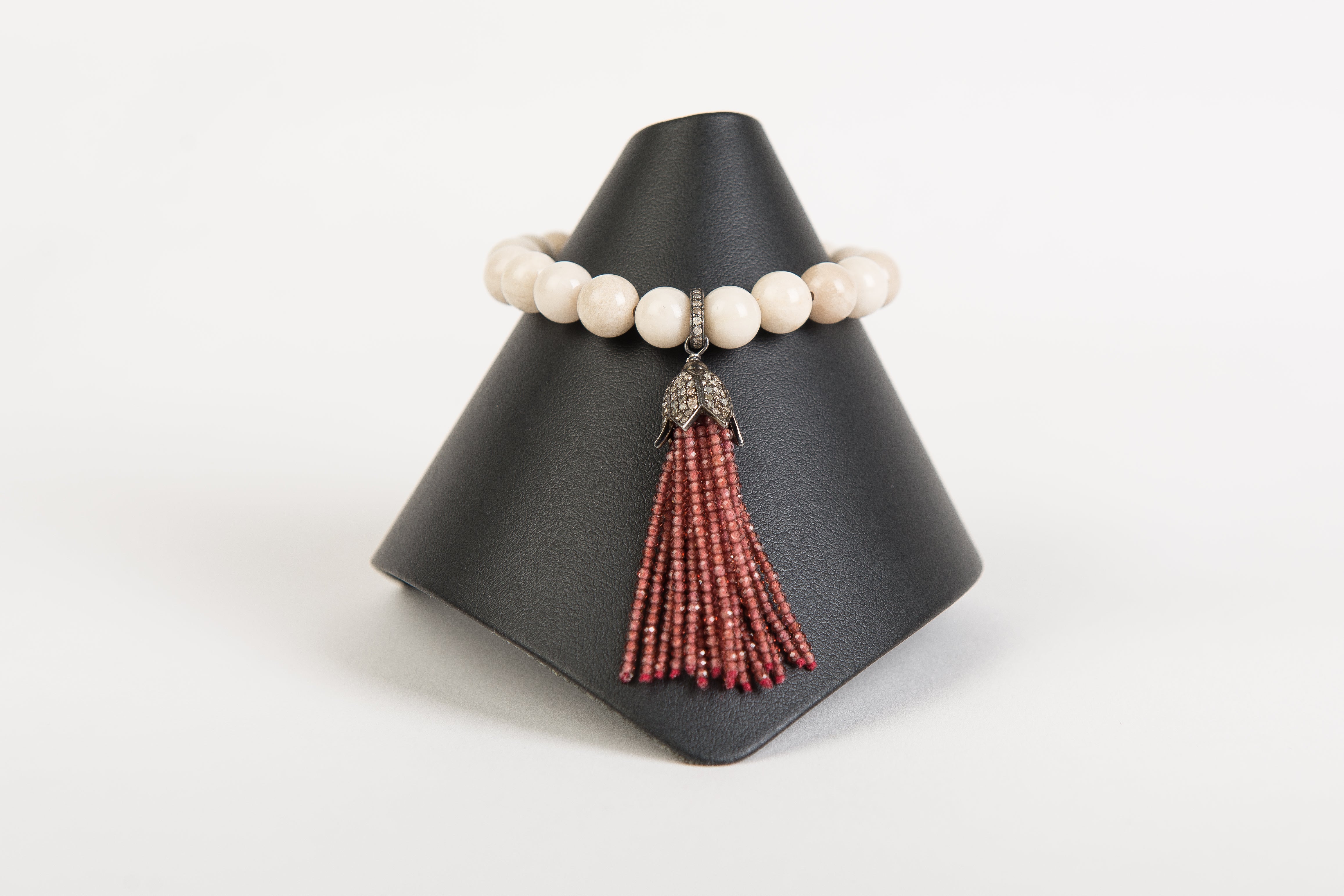 Blush garnet and pave diamond tassel on neutral agate