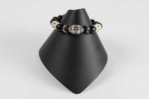 Carved bone and black onyx with rose cut diamond bead