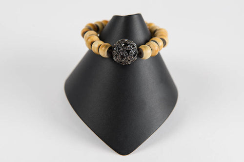 Horn with black spinel bead