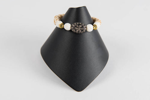 Carved bone and wood with pave diamond bead