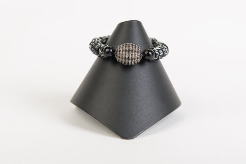 White topaz focal bead with painted bone and black onyx