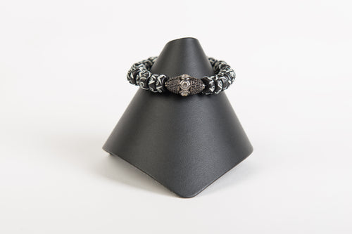 White topaz focal bead on hand painted bone